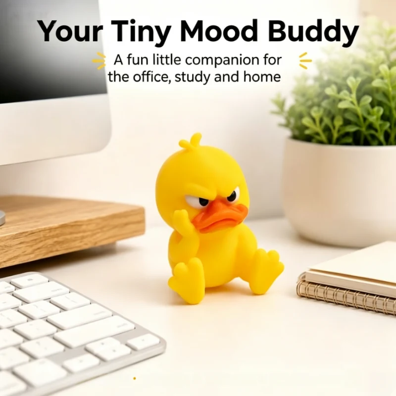 Mini sitting angry duck displayed beside a computer keyboard