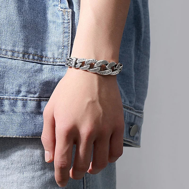 Retro silver mantra bracelet worn with casual outfit