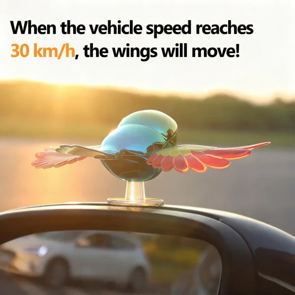 Flying bird decoration with wings moving on a vehicle at 30 kilometers per hour