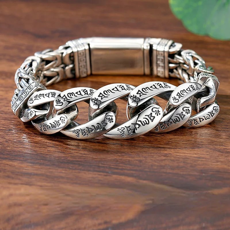 Retro silver six-syllable mantra bracelet on wood surface