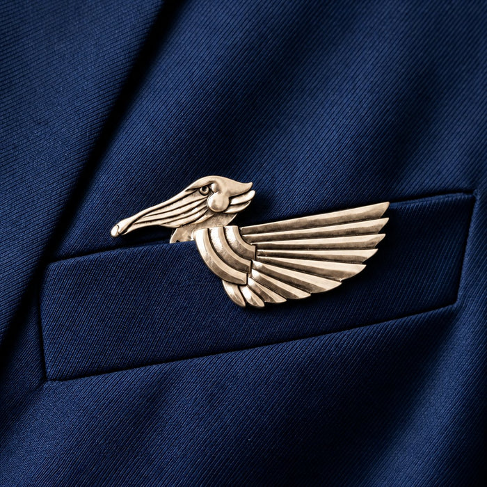 Flying bird animal brooch