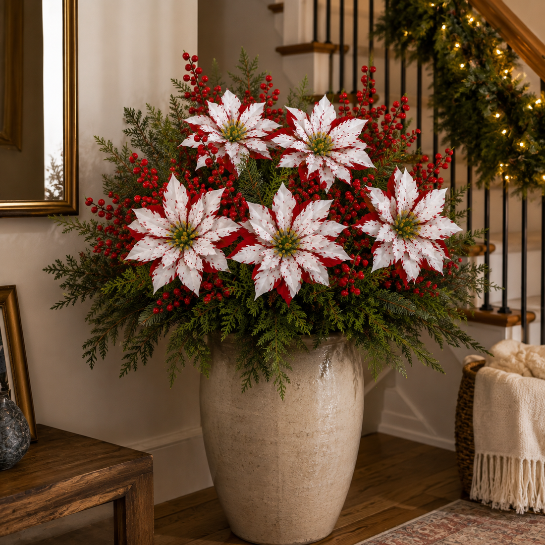 Poinsettia and evergreen arrangement in a bright indoor entryway