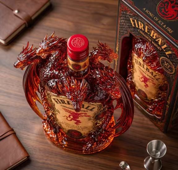 Overhead view showing dragon heads and wings surrounding the bottle